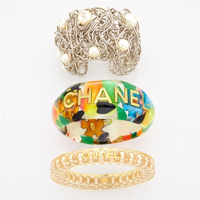 Lot 274 - Chanel Three Metal Wire, Multicolored Resin, Imitation Pearl and Strass Cuff and Bangle Bracelets