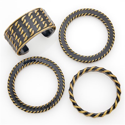 Lot 278 - Chanel Three Black Enameled Metal Bangle Bracelets and Cuff Bracelet