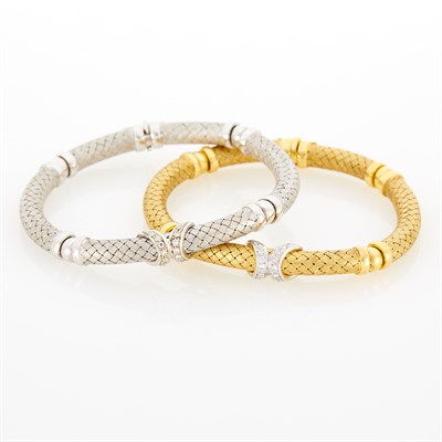 Lot 244 - Pair of Two-Color Gold and Diamond Link Bracelets