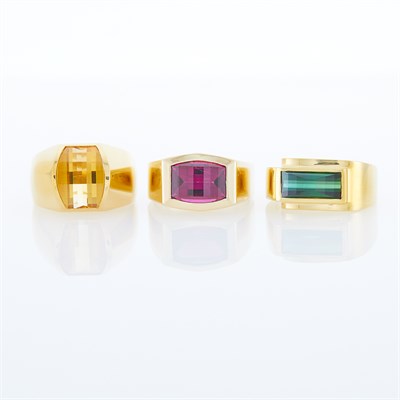 Lot 1153 - Three Gold, Green Tourmaline, Citrine and Rhodolite Garnet Rings