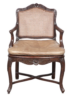 Lot 43 - Régence Stained Beechwood and Caned Fauteuil à...