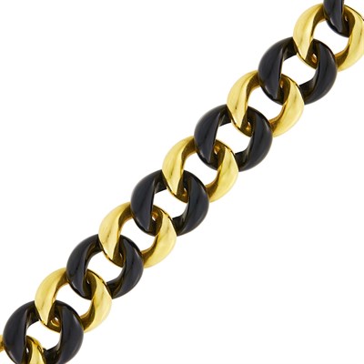 Lot 31 - Seaman Schepps Gold and Black Onyx Curb Link Bracelet