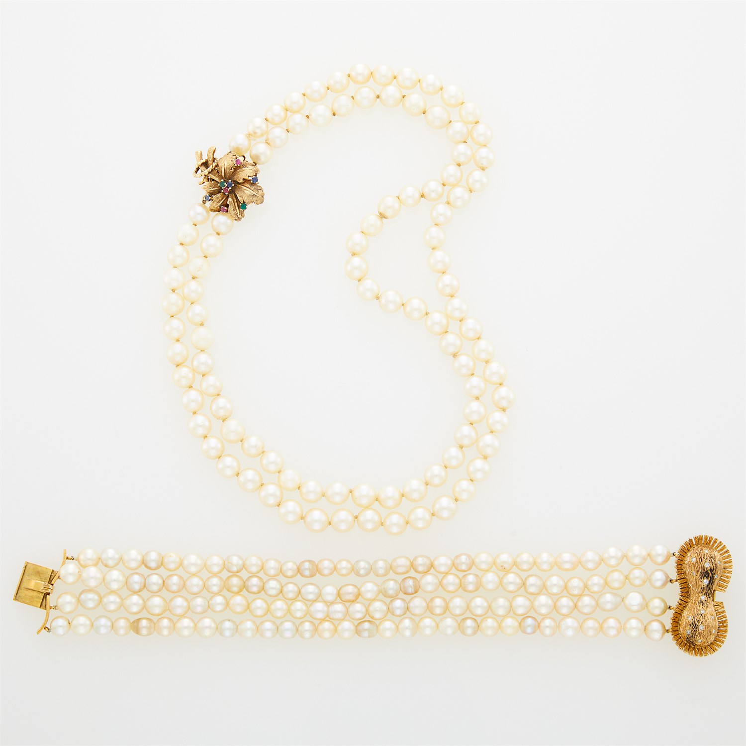 Lot 23 - Double Strand Cultured Pearl Necklace and Four Strand Bracelet with Gold, Diamond and Gem-Set Clasps