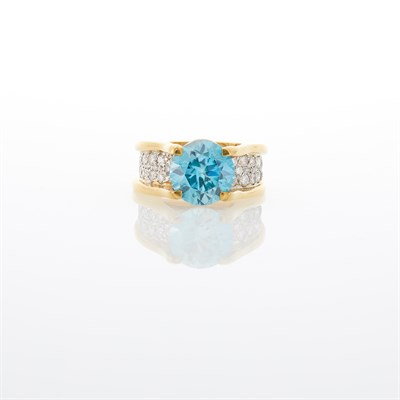 Lot 1035 - Two-Color Gold, Blue Zircon and Diamond Ring