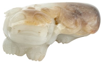 Lot 58 - A Chinese Pale Celadon and Russet Jade Qilin...