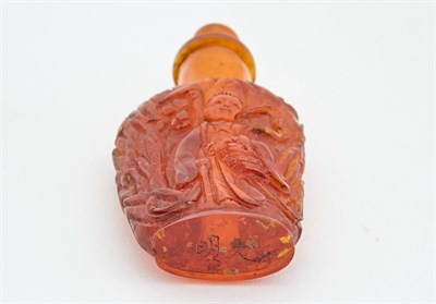 Lot 2 - A Chinese Amber Snuff Bottle Carved in the...