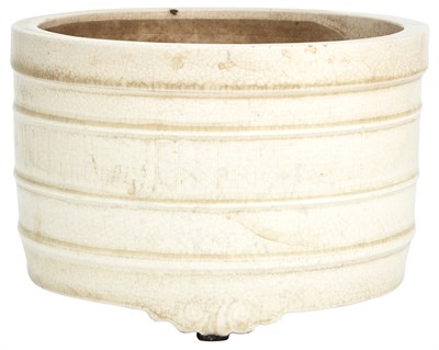 Lot 226 - A Chinese Cream Glazed Earthenware Tripod...