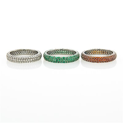 Lot 45 - Three Silver, Diamond, Tsavorite Garnet and Garnet Band Rings
