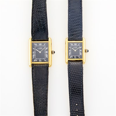 Lot 201 - Must de Cartier Paris Lady's and Gentleman's Gold-Plated Silver 'Tank' Wristwatches