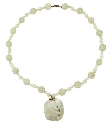 Lot 45 - A Chinese Carved White Jade Pendant and Beaded...