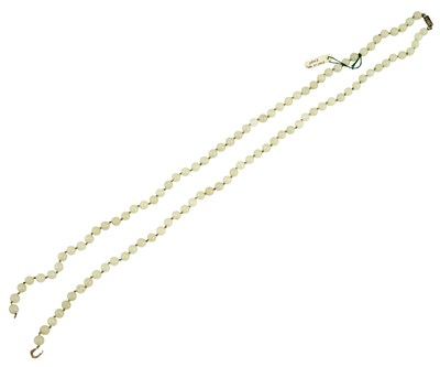 Lot 40 - A Chinese Strand of Carved White Jade Beads...