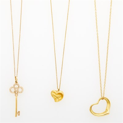 Lot 1016 - Three Tiffany & Co. Gold, High Karat Gold and Diamond Pendant-Necklaces