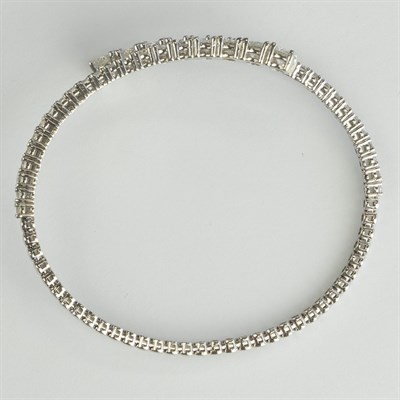 Lot 1078 - White Gold and Diamond Crosover Bangle Bracelet