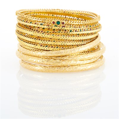 Lot 1106 - Seven High Karat Gold and Enamel Bangle Bracelets and Four Gold Repoussé Bangle Bracelets