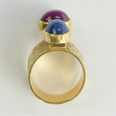 Lot 1048 - Ed Wiener Modernist Hammered Gold and Synthetic Star Sapphire and Synthetic Star Ruby Ring