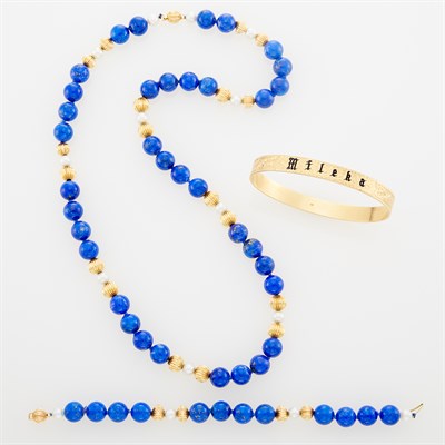 Lot 1132 - Long Gold and Lapis Bead and Cultured Pearl Necklace/Bracelet Combination and Gold and Enamel Bangle Bracelet