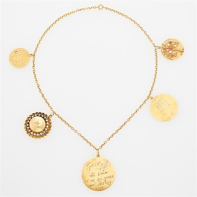 Lot 59 - CELESTE HOLM Gold and Gold Charm Necklace. 14...