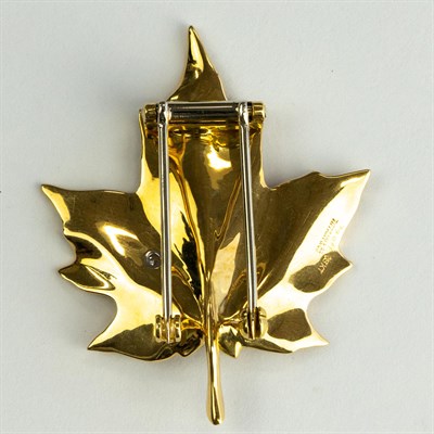 Lot 1216 - Tiffany & Co. Gold and Diamond Maple Leaf Clip-Brooch