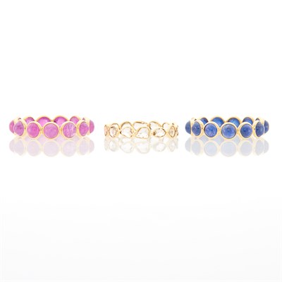 Lot 1019 - Three Gold, Cabochon Ruby and Sapphire and Diamond Band Rings