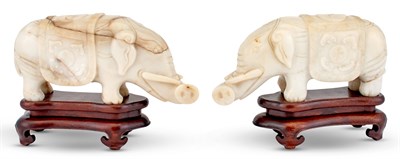 Lot 1064 - A Pair of Chinese Carved Hardstone Elephants...