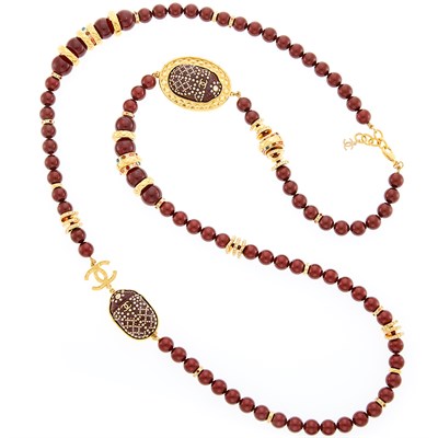 Lot 1056 - Chanel Long Gold-Tone Metal, Red Lacquer Bead and Multicolored Rhinestone Scarab Necklace