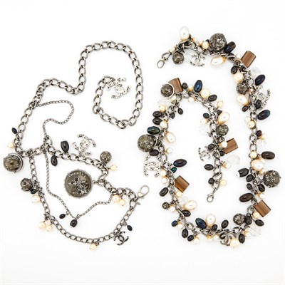 Lot 2086 - Chanel Two Long Gilt-Metal, Imitation Pearl, Rhinestone, Bead and Globe Charm Belts, France