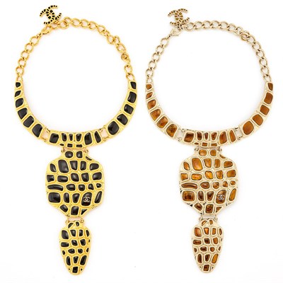 Lot 2075 - Two Chanel Gilt-Metal, Brown and Black Enamel 'Metiers D'Art Collection Along the Nile' Pendant-Necklaces