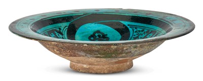 Lot 1259 - A Kashan Turqouise Glazed Earthenware Dish...