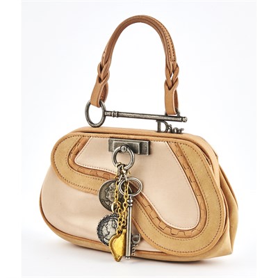 Lot 1307 - Christian Dior Pink Satin Charm Mini Saddle Bag