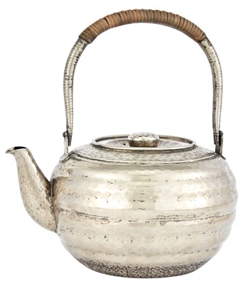 Lot 1221 - A Japanese Hammered Silver Teapot Meiji-Taisho...
