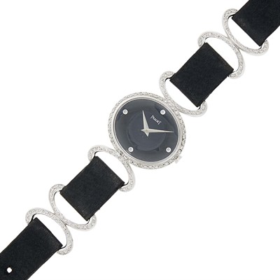 Lot 69 - Piaget White Gold, Diamond, Black Onyx and Black Satin Wristwatch