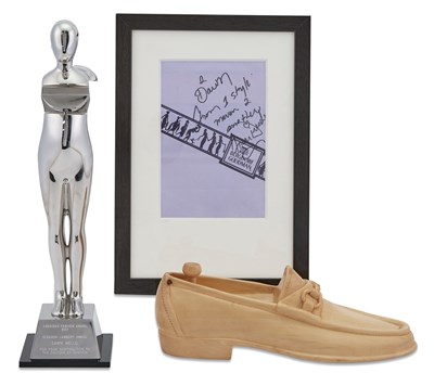 Lot 136 - GUCCI A Carved Wood Gucci Loafer Presented to...