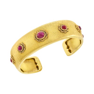 Lot 132 - Buccellati Gold and Cabochon Ruby Bangle Bracelet