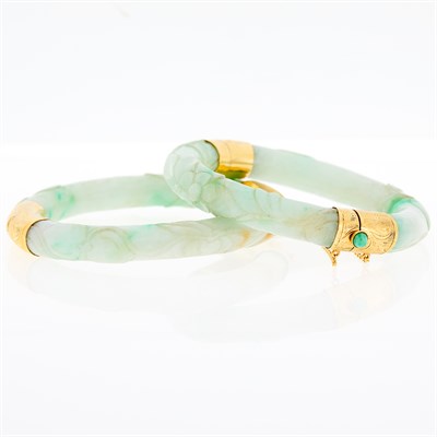Lot 180 - Two Carved Jade and Gold Bangle Bracelets