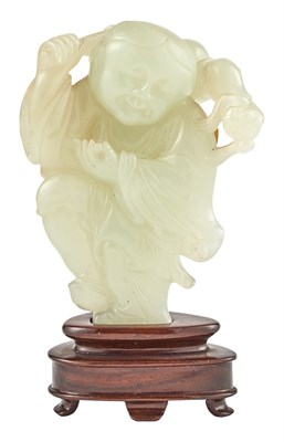 Lot 31 - A Chinese Light Celadon Jade Figural Carving...