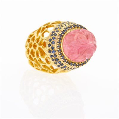 Lot 109 - Gold, Carved Pink Tourmaline and Sapphire Dome Ring