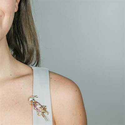 Lot 167 - Tiffany & Co., Schlumberger Gold, Platinum, Diamond and Multicolored Sapphire Cricket Brooch, France