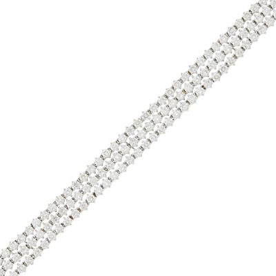 Lot 150 - Triple Strand White Gold and Diamond Bracelet