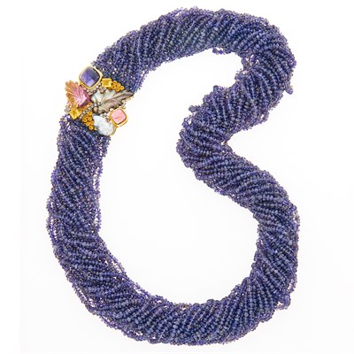 Lot 1057 - Puttini Long Multistrand Tanzanite Bead Torsade Necklace with Gold, Gem-Set and Baroque Cultured Pearl Brooch-Clasp