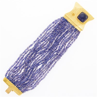 Lot 1055 - Puttini Twenty Strand Tanzanite Bead Bracelet with Gold and Cabochon Tanzanite Clasp
