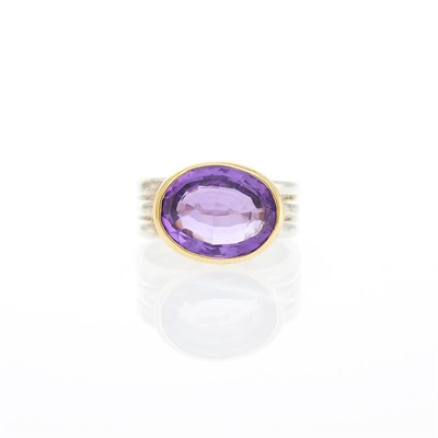 Lot 1266 - Silver, Gold and Amethyst Ring