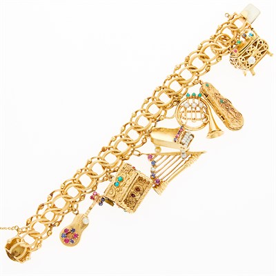 Lot 1081 - Gold and Gem-Set Musical Instrument Charm Bracelet