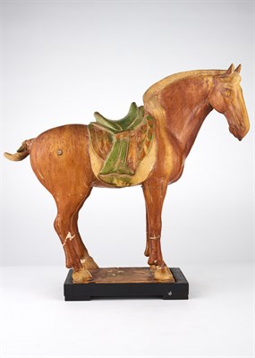 Lot 104 - A Chinese Sancai Glazed Pottery Figure of a...