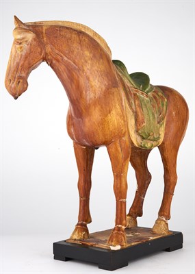Lot 104 - A Chinese Sancai Glazed Pottery Figure of a...