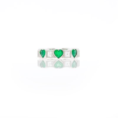 Lot 1191 - White Gold, Emerald and Diamond Heart Band Ring
