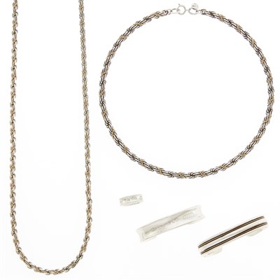 Lot 1267 - Tiffany & Co. Two Sterling Silver and Gold Necklaces, Two Cuff Bracelets and Band Ring