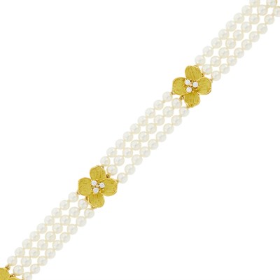 Lot 10 - Tiffany & Co. Triple Strand Cultured Pearl, Gold and Diamond 'Dogwood' Flower Bracelet