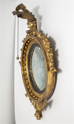Lot 1240 - Classical Giltwood and Ebonized Convex Mirror...