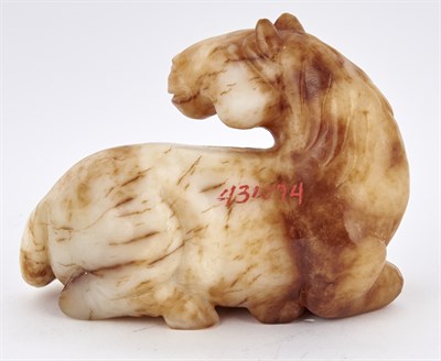 Lot 23 - A Chinese Mottled Jade Carving of a Horse Ming-...