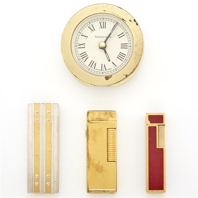 Lot 1300 - Tiffany & Co. Metal Clock, Two Cartier Lighters and Dunhill Lighter